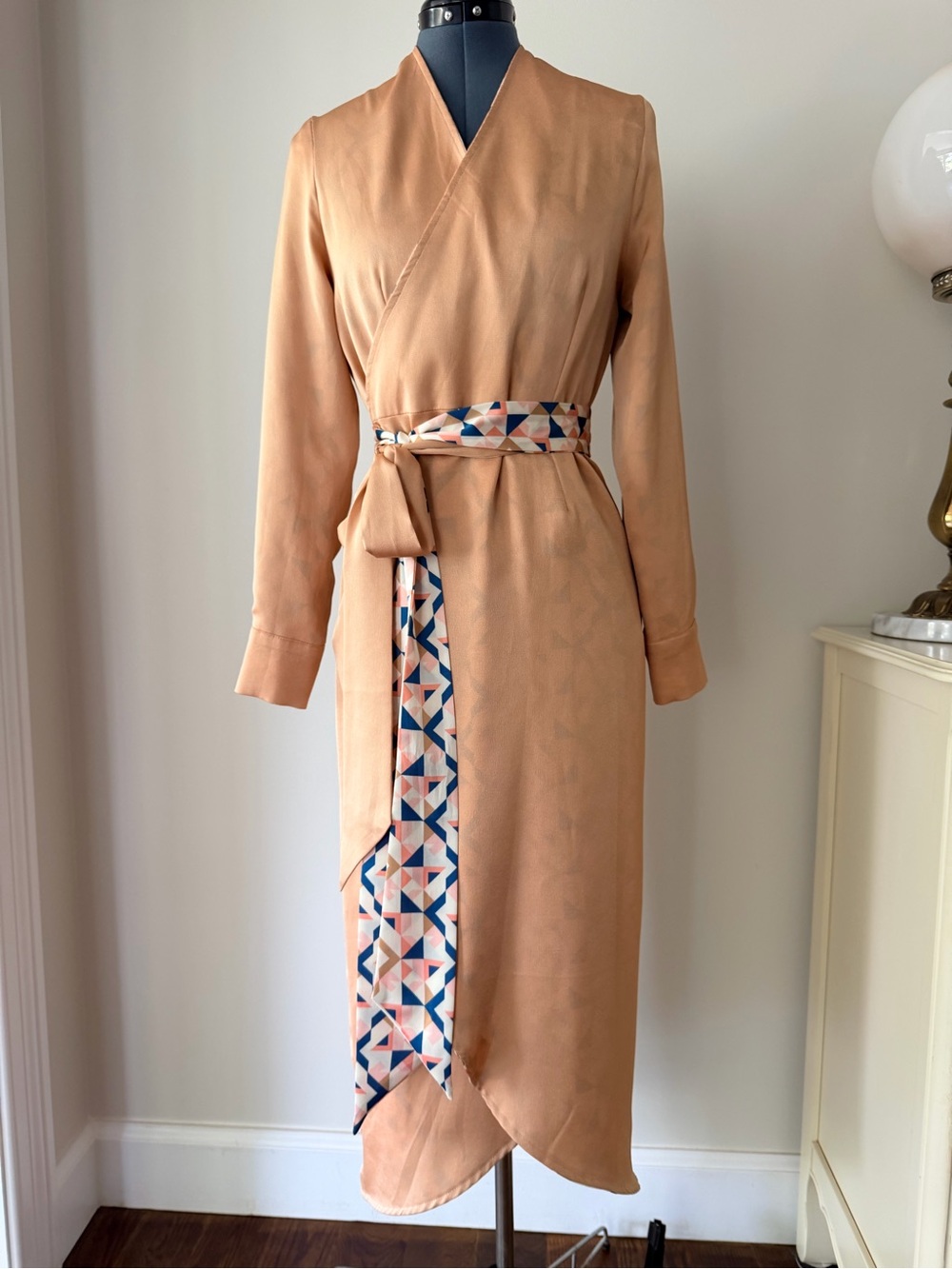Never Fully Dressed Peach Long Sleeve Wrap Midi Dress with Geometric Sash